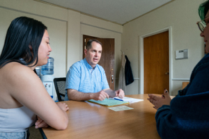 Pippert talks with Augsburg Family Scholars students. (Photo by Courtney Perry)